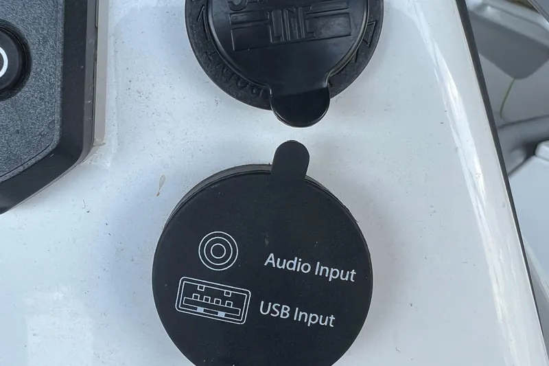 Slide: The Image of Audio and USB input ports on a 2022 Tahoe 2150 CC boat. - 19