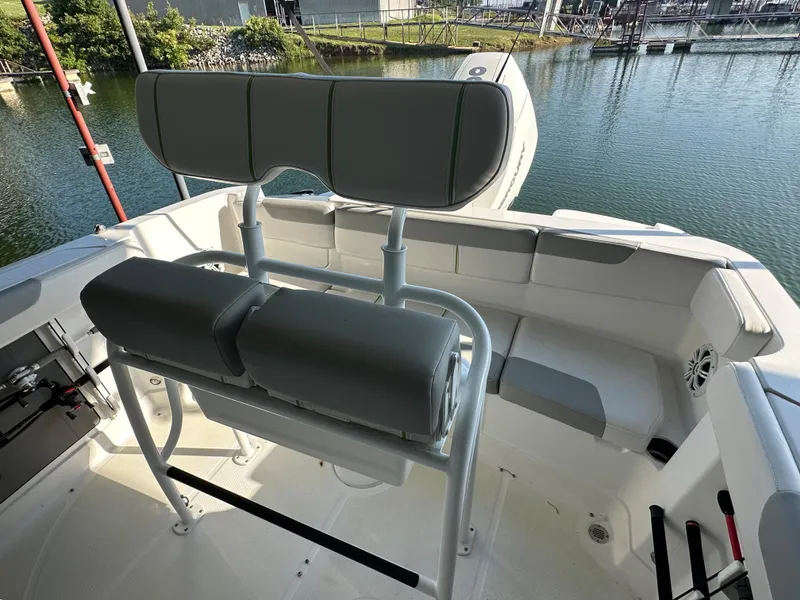 Slide: The Image of 2022 Tahoe 2150 CC boat interior with seating and water view. - 20