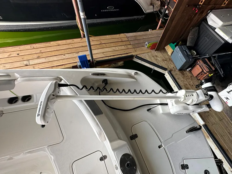 Slide: The Image of 2022 Tahoe 2150 CC boat with Minn Kota trolling motor at dock. - 25