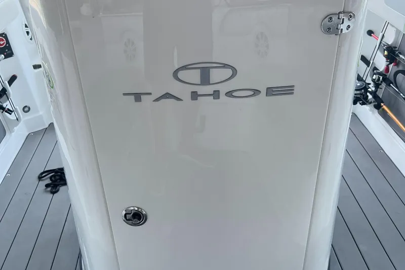Slide: The Image of 2022 Tahoe 2150 CC boat interior with logo on white panel. - 26
