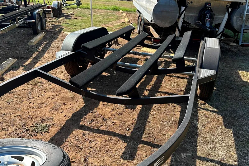 Slide: The Image of 2022 Tahoe 2150 CC boat trailer on dry land. - 35