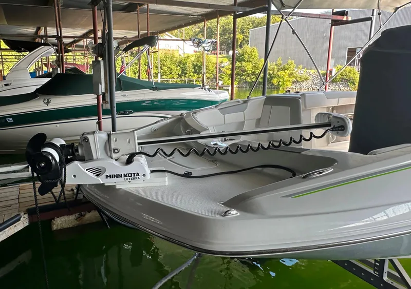 Slide: The Image of 2022 Tahoe 2150 CC boat with Minn Kota trolling motor docked. - 9