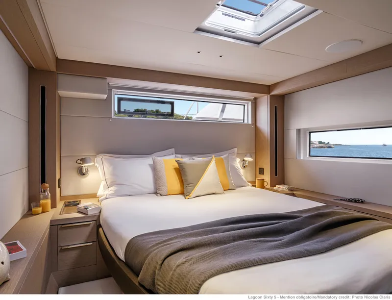 Slide: The Image of Luxurious bedroom interior of 2025 Lagoon Sixty5 yacht with ocean view. - 11