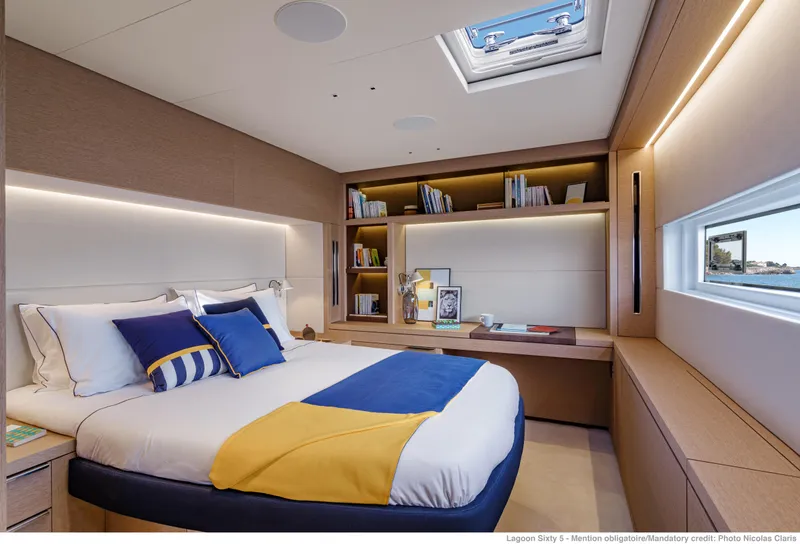 Slide: The Image of Luxurious bedroom interior of 2025 Lagoon Sixty5 yacht with modern design and skylight. - 3