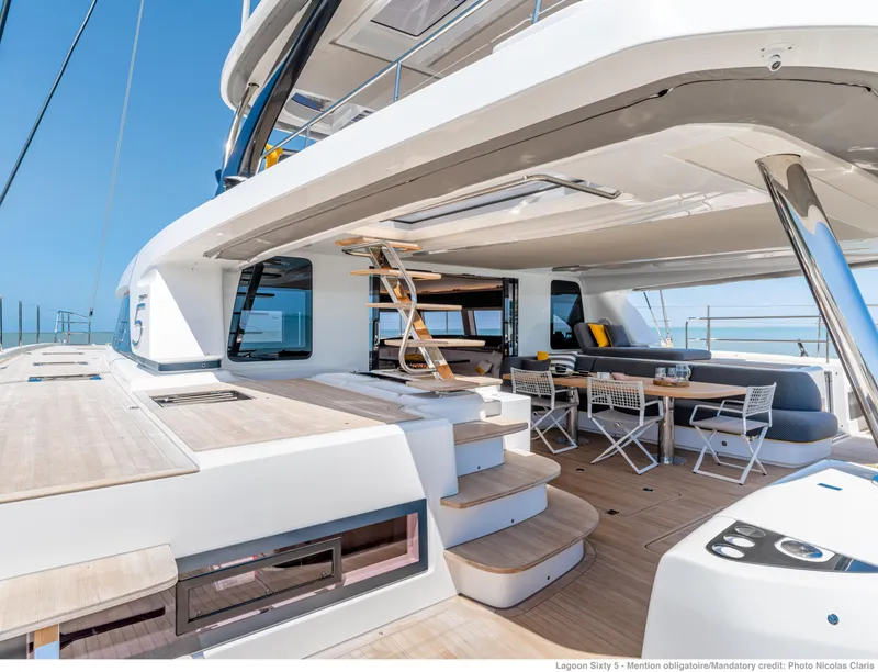 Slide: The Image of Luxurious 2025 Lagoon Sixty5 yacht deck with seating and modern design. - 9