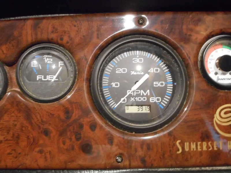 Slide: The Image of 2006 Sumerset Double Dippin dashboard with fuel and RPM gauges. - 10