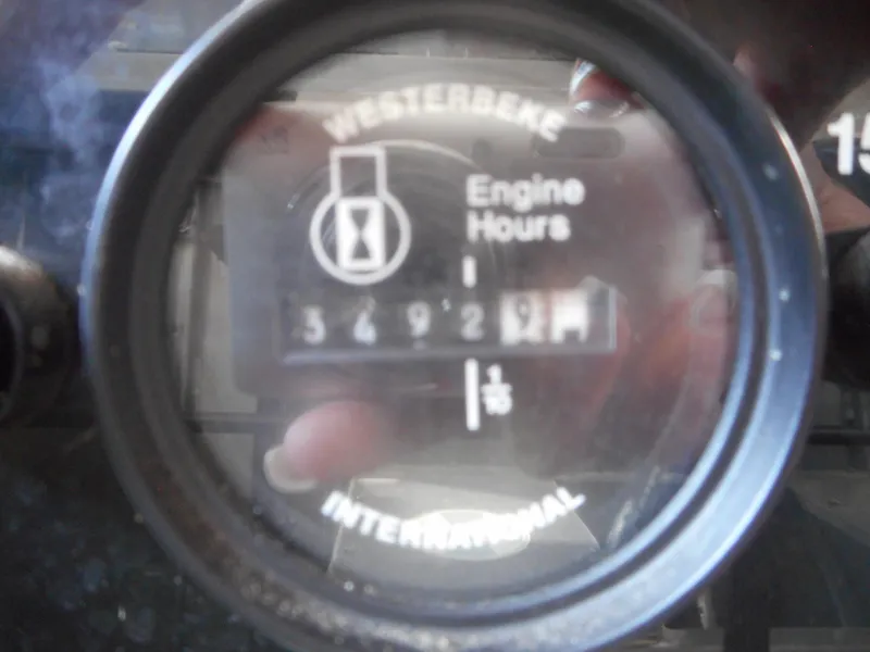 Slide: The Image of Westerbeke engine hour meter showing 3492.9 hours on a 2006 Sumerset Double Dippin. - 11