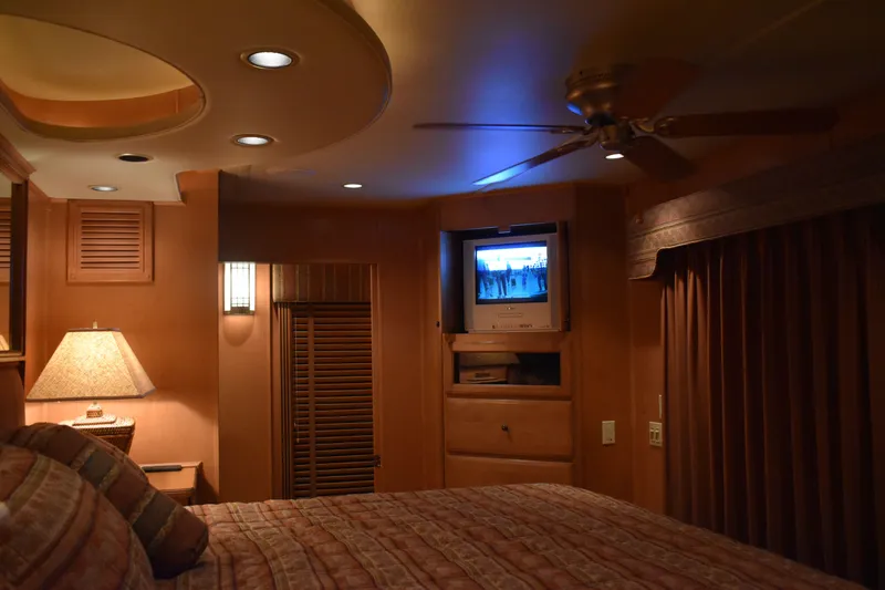 Slide: The Image of Cozy bedroom in 2006 Sumerset Double Dippin houseboat with TV and ceiling fan. - 14
