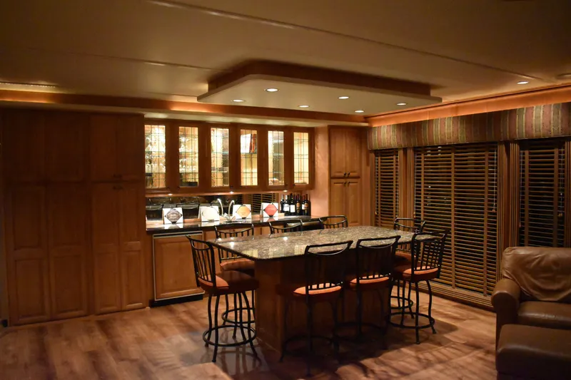 Slide: The Image of Luxurious kitchen in 2006 Sumerset Double Dippin houseboat with granite island and wooden cabinets. - 15