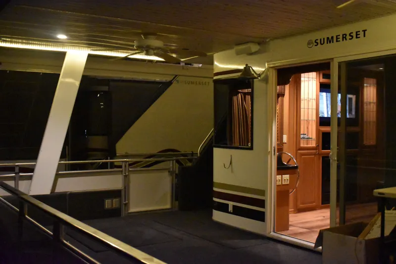Slide: The Image of 2006 Sumerset Double Dippin houseboat interior with modern amenities and stylish design. - 28