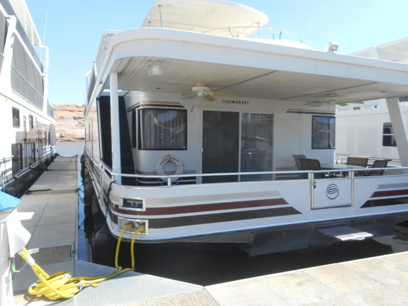 Slide: The Image of 2006 Sumerset Double Dippin houseboat docked at marina. - 3