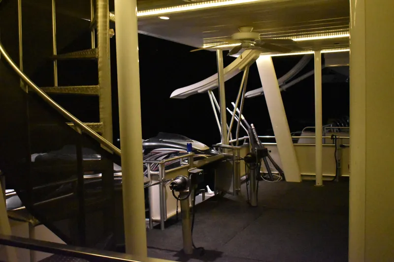 Slide: The Image of Interior view of 2006 Sumerset Double Dippin houseboat at night with spiral staircase. - 35