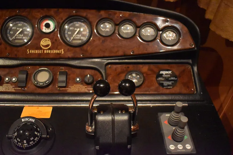 Slide: The Image of Control panel of a 2006 Sumerset Double Dippin houseboat with gauges and levers. - 37