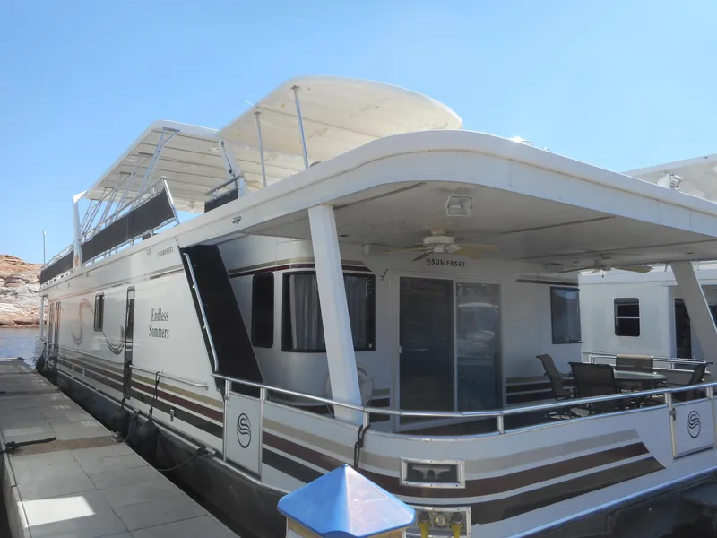 Slide: The Image of 2006 Sumerset Double Dippin houseboat docked at marina. - 4