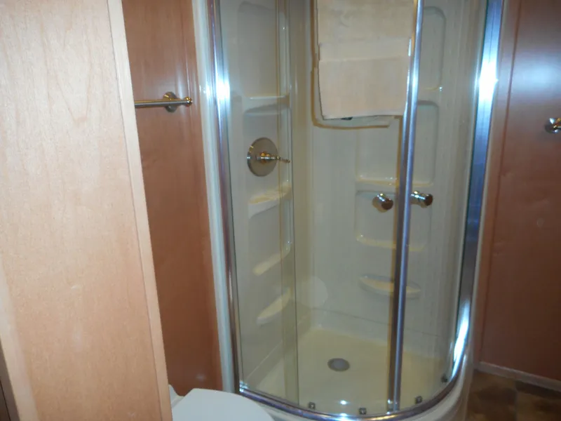 Slide: The Image of 2006 Sumerset Double Dippin bathroom with enclosed shower and wooden cabinetry. - 40