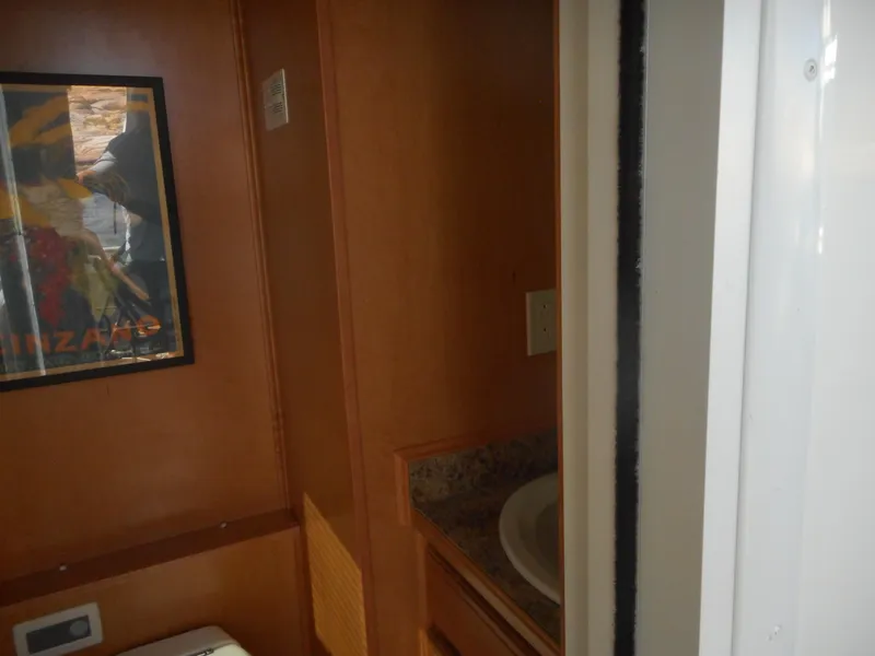 Slide: The Image of Interior view of 2006 Sumerset Double Dippin houseboat bathroom with sink and wall art. - 42
