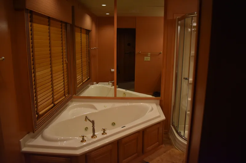 Slide: The Image of Luxurious bathroom in 2006 Sumerset Double Dippin houseboat with corner bathtub and shower. - 43