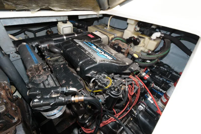 Slide: The Image of 1997 Sea Ray 330 Sundancer engine compartment with MerCruiser engine. - 14