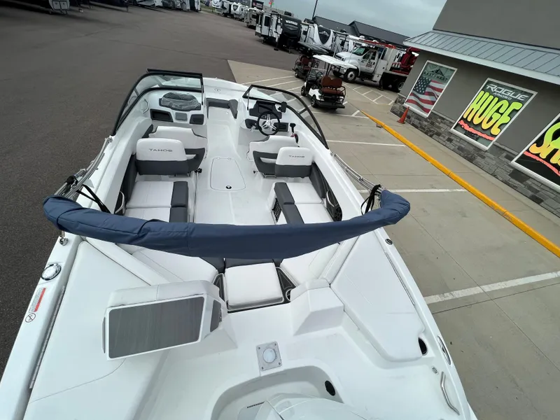 Slide: The Image of 2024 Tahoe 210 S boat with spacious seating and modern design. - 12