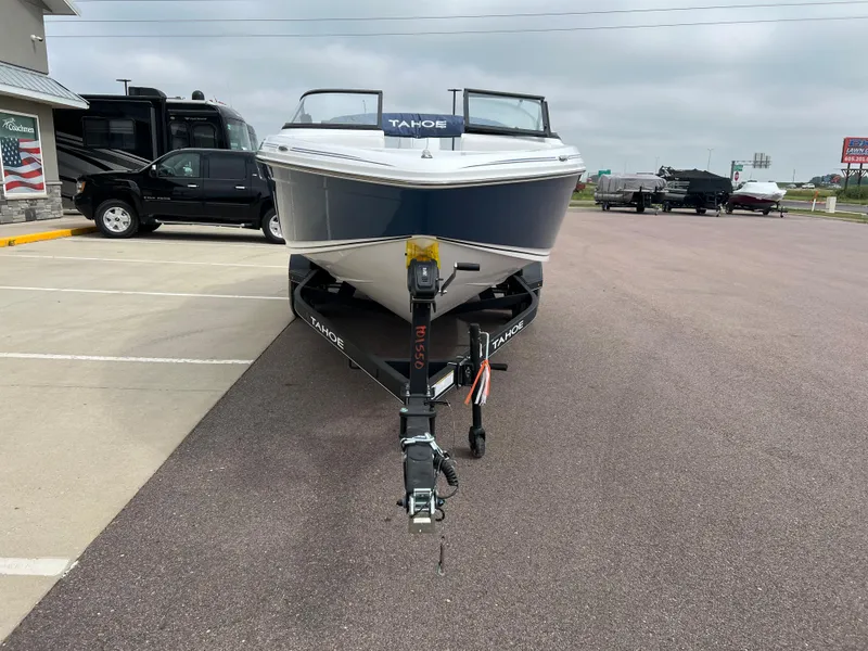 Slide: The Image of 2024 Tahoe 210 S boat on trailer in parking lot. - 3