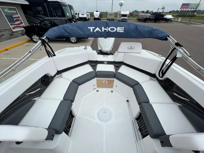 Slide: The Image of 2024 Tahoe 210 S boat interior with spacious seating and canopy. - 9