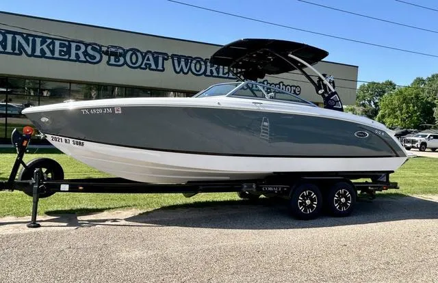 Slide: The Image of 2021 Cobalt R7 Surf boat on trailer at Rinker's Boat World. - 1