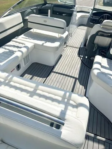 Slide: The Image of 2021 Cobalt R7 Surf boat interior with white cushioned seating and sleek design. - 14