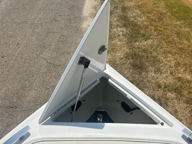 Slide: The Image of 2021 Cobalt R7 Surf boat with luxurious white seating and spacious layout. - 16