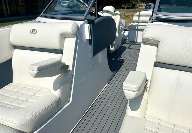Slide: The Image of 2021 Cobalt R7 Surf boat with white leather seating and modern design. - 18