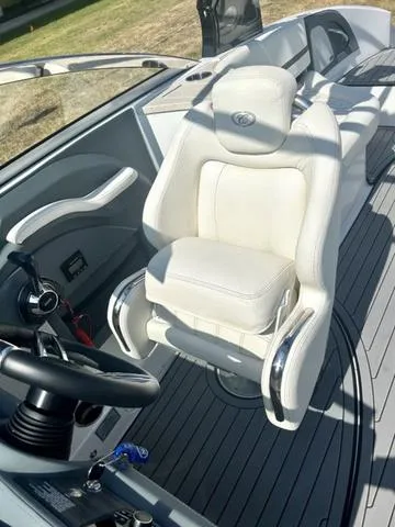 Slide: The Image of 2021 Cobalt R7 Surf boat interior with white captain's chair and control panel. - 28