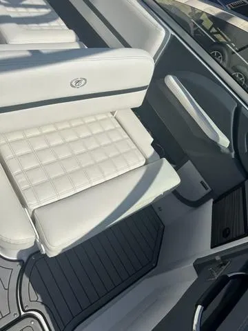 Slide: The Image of 2021 Cobalt R7 Surf boat interior with white captain's chair and steering wheel. - 29