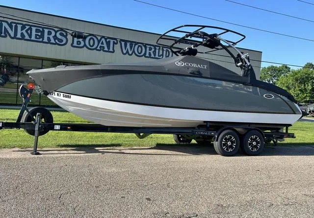 Slide: The Image of 2021 Cobalt R7 Surf boat on trailer at a dealership. - 3