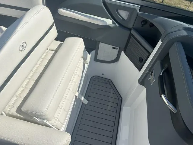 Slide: The Image of 2021 Cobalt R7 Surf boat interior with white cushioned seating. - 30