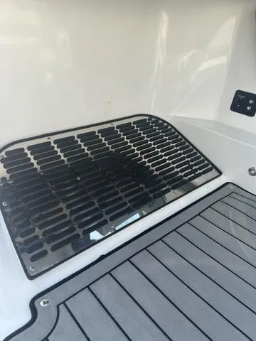 Slide: The Image of 2021 Cobalt R7 Surf boat cockpit with steering wheel and captain's chair. - 35