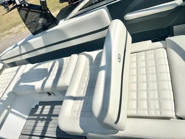 Slide: The Image of 2021 Cobalt R7 Surf boat cockpit with steering wheel and captain's chair. - 39