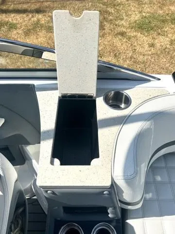 Slide: The Image of Interior seating and cup holders of a 2021 Cobalt R7 Surf boat. - 45