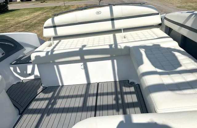 Slide: The Image of 2021 Cobalt R7 Surf boat interior with dual cup holders and storage net. - 47