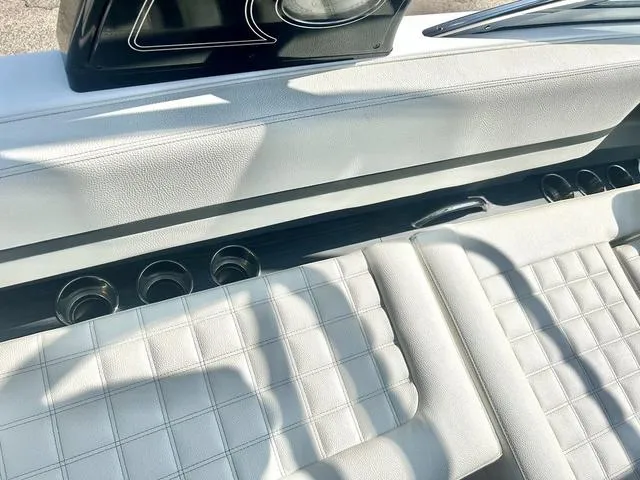 Slide: The Image of 2021 Cobalt R7 Surf boat with white cushioned seating and gray deck. - 48