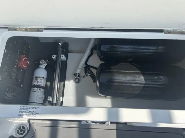 Slide: The Image of 2021 Cobalt R7 Surf boat interior with white quilted seats and cup holders. - 49