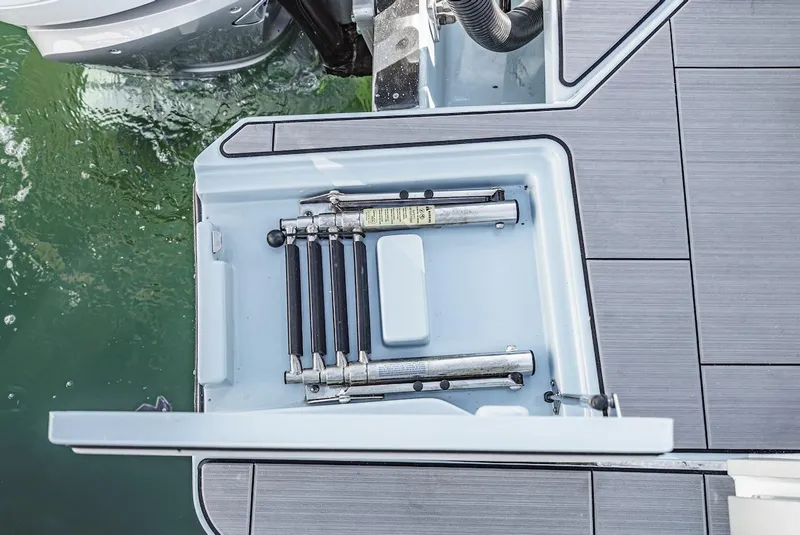 Slide: The Image of 2024 Aviara AV 32 boat with integrated swim ladder compartment. - 10