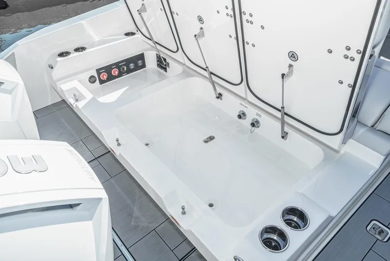Slide: The Image of 2024 Aviara AV 32 boat interior with storage compartments and control panel. - 11
