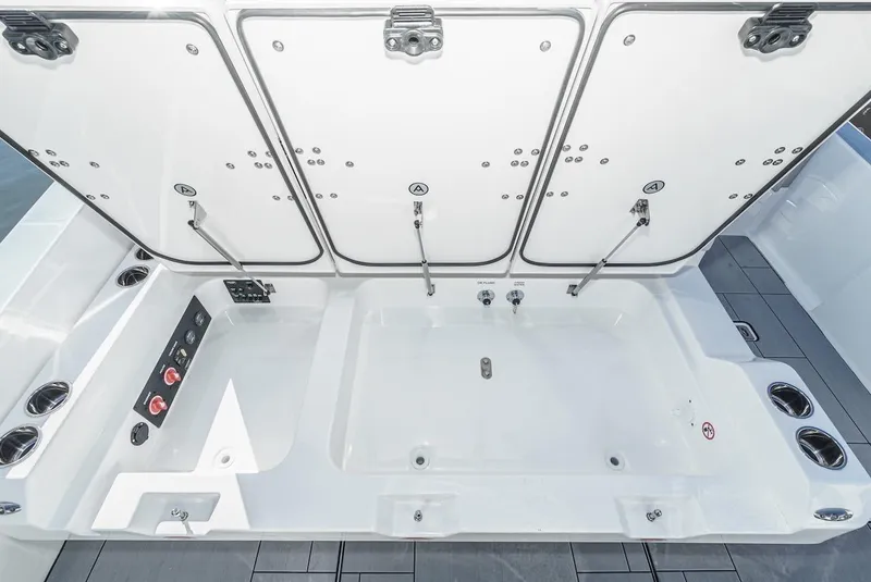 Slide: The Image of 2024 Aviara AV 32 boat storage compartments and utility area. - 12