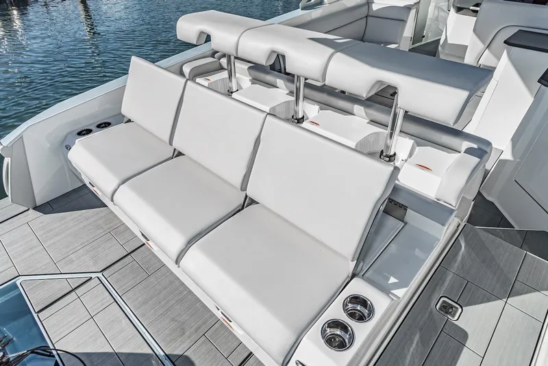 Slide: The Image of 2024 Aviara AV 32 boat with luxurious seating and cup holders. - 14