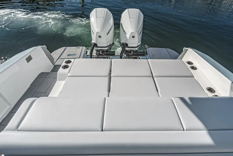 Slide: The Image of 2024 Aviara AV 32 boat with twin outboard engines and spacious sunpad. - 15