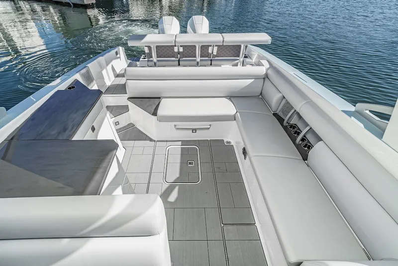 Slide: The Image of 2024 Aviara AV 32 boat interior with luxurious white seating and modern design. - 16