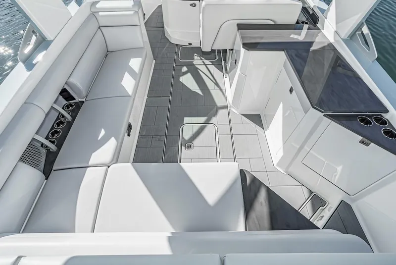 Slide: The Image of 2024 Aviara AV 32 boat interior with white seating and modern amenities. - 17