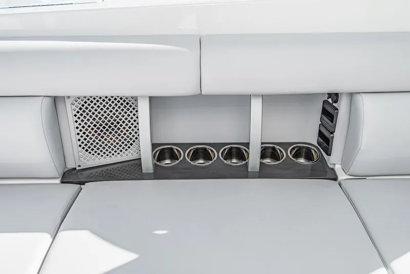 Slide: The Image of 2024 Aviara AV 32 boat interior with cup holders and seating. - 20