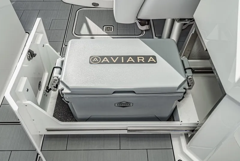 Slide: The Image of 2024 Aviara AV 32 boat with integrated cooler storage drawer. - 22