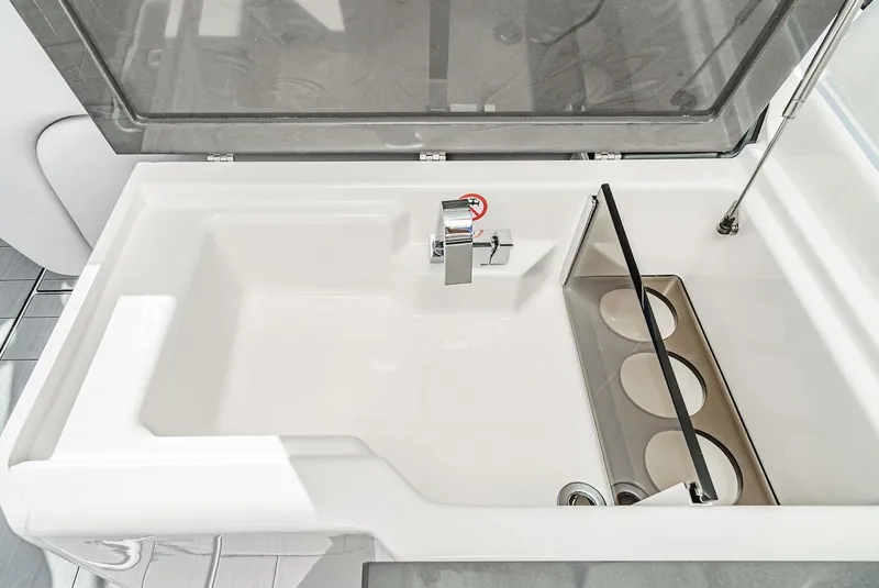 Slide: The Image of 2024 Aviara AV 32 boat sink and cup holders. - 23