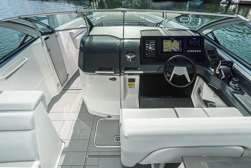 Slide: The Image of 2024 Aviara AV 32 boat cockpit with modern navigation system and luxurious seating. - 27